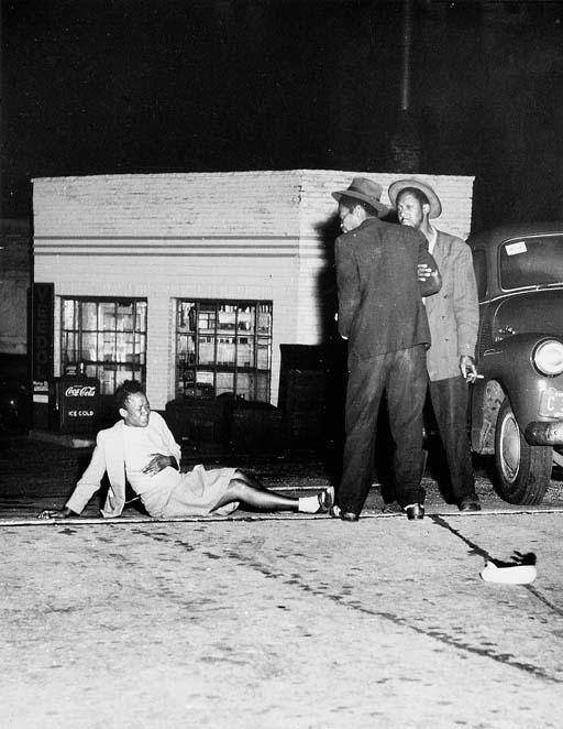 Untitled (Woman knocked over in brawl) by Weegee | Art.Salon